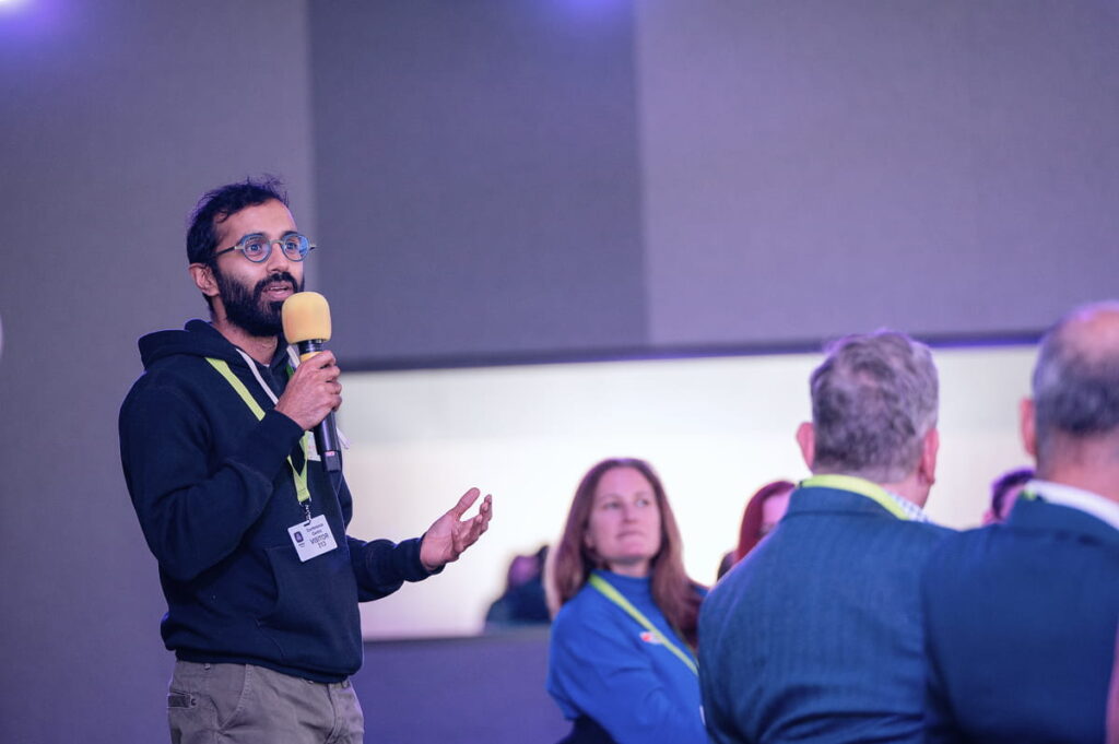 a man making his speech in a mic